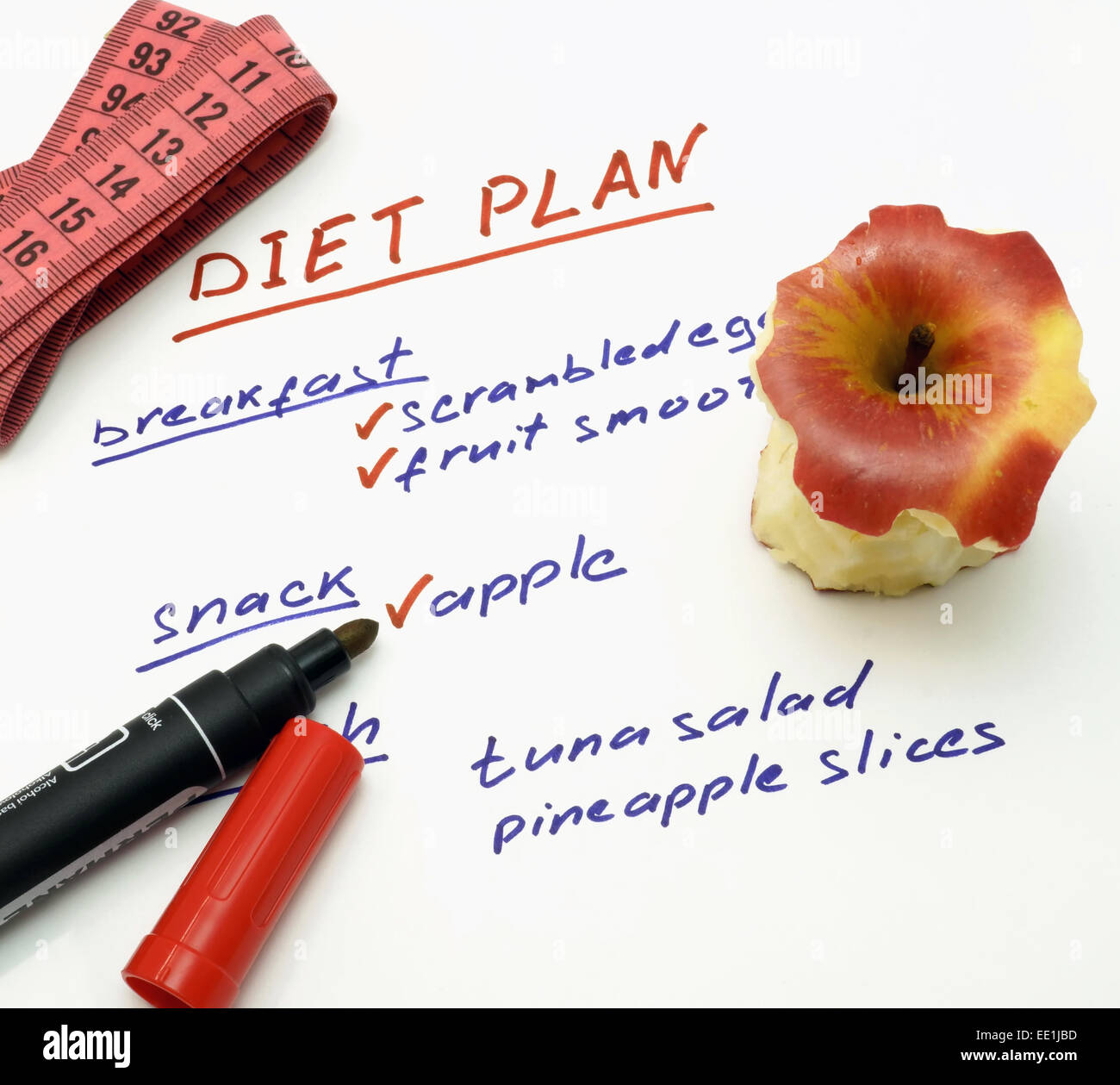 Diet plan with apple, marker and measuring tape Stock Photo