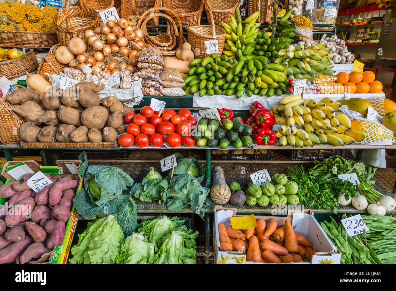 Vendors inside the Funchal Market, where fresh produce and fish are sold in the capital city of Funchal, Madeira, Portugal Stock Photo