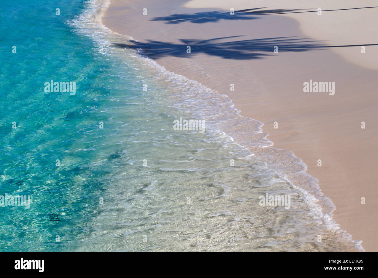 The Crystal Clear Water Of The Indian Ocean With A Deserted Beach