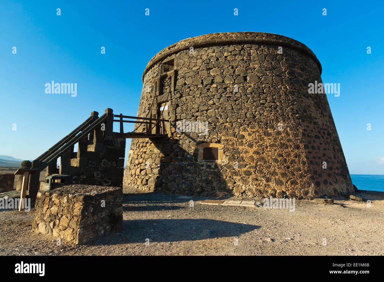 Old tower (toston), a defence against English pirates at this northwest coast village, El Cotillo, Fuerteventura, Canary Islands Stock Photo