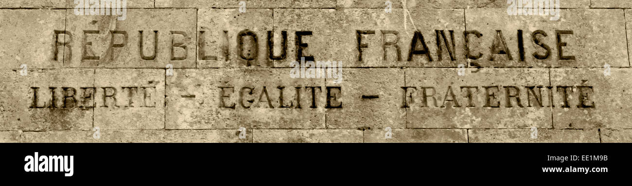 French Republic: Liberty, Equality, Fraternity sign on stone wall Stock Photo