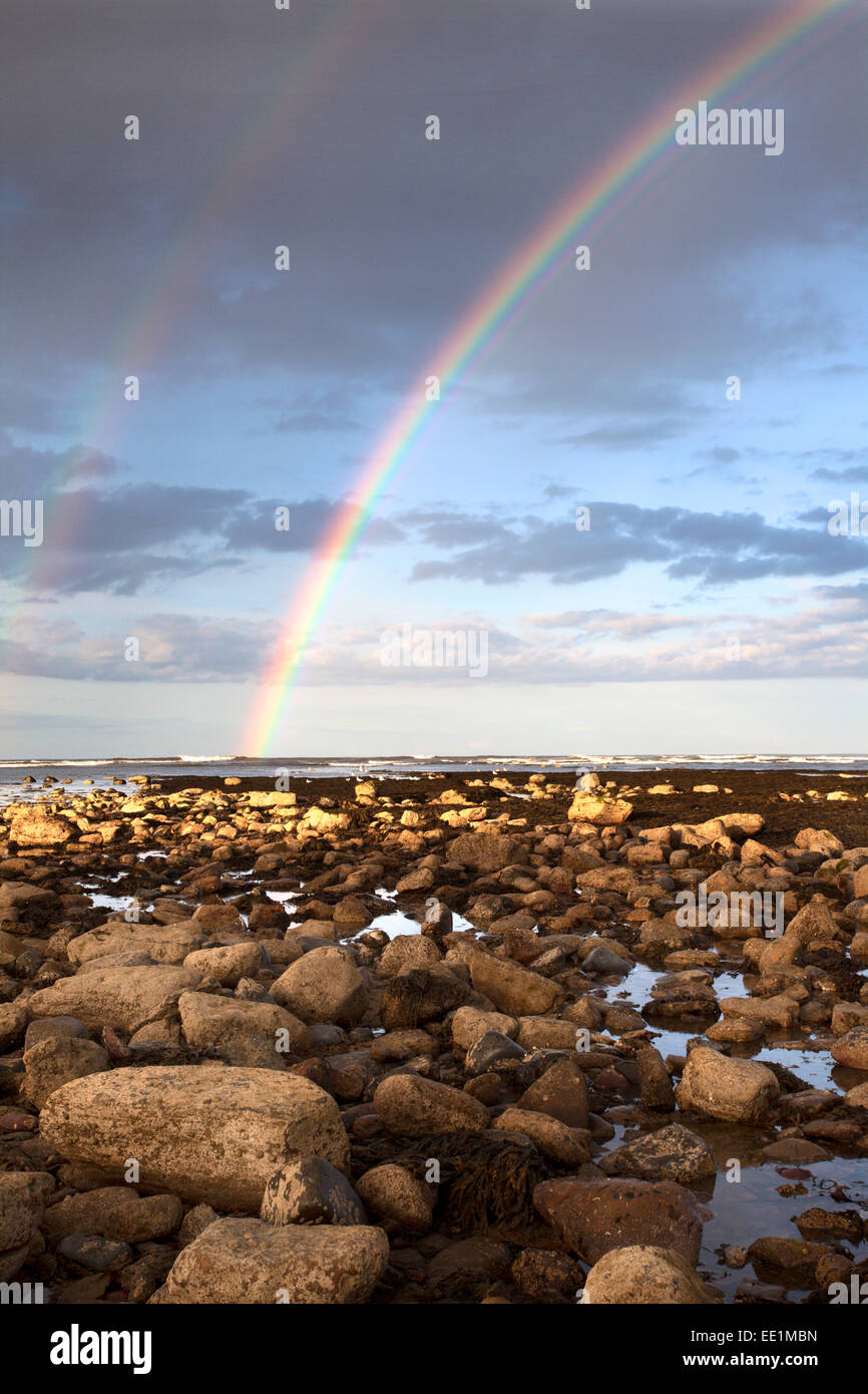 Rainbow over the sea at Robin Hoods Bay, Yorkshire, England, United Kingdom, Europe Stock Photo