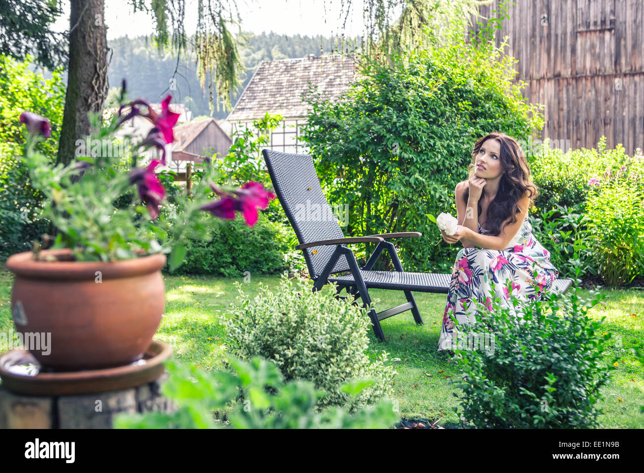 portrait of a young woman in the garden Stock Photo - Alamy