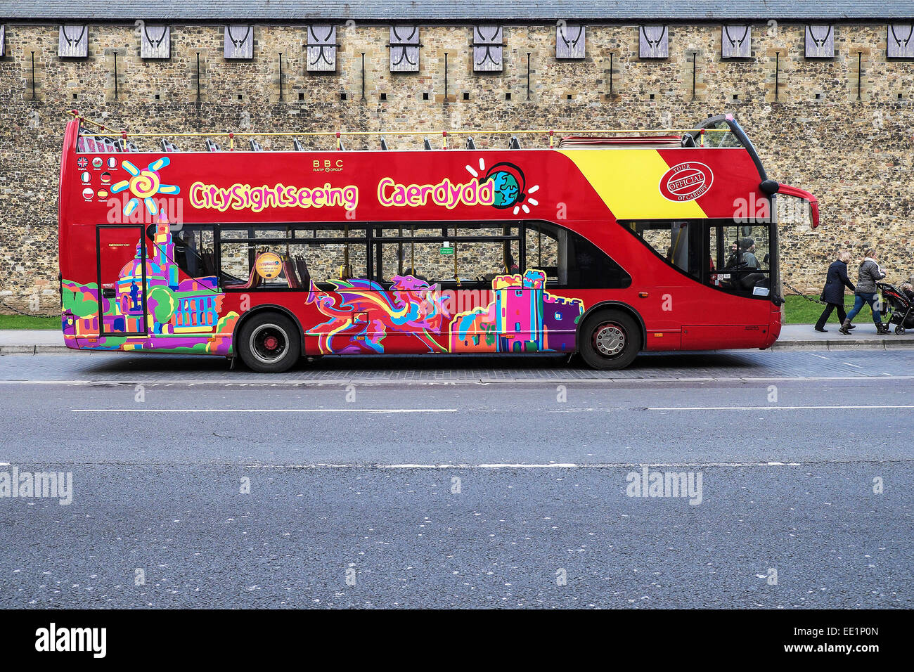 A Cardiff open-topped sightseeing bus parked outside Cardiff Castle. Stock Photo