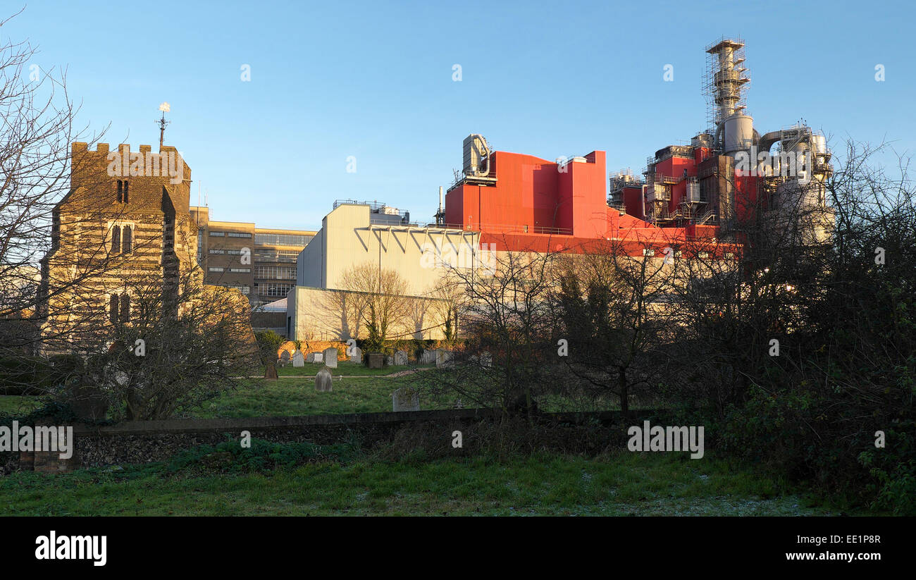 St Clements Church and the Proctor and Gamble factory in Essex. Stock Photo