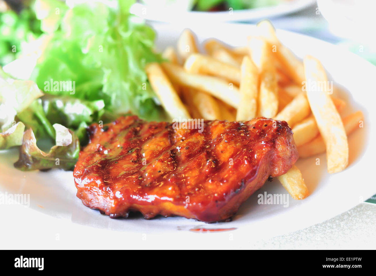 Pork loin steak in a dish Serve with French fries Stock Photo Alamy