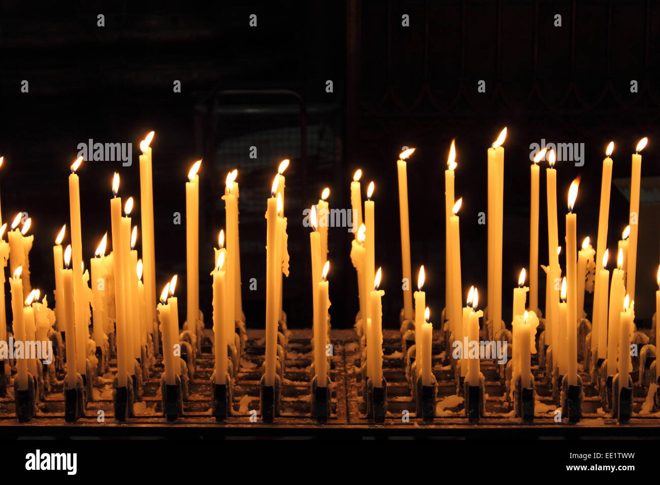 Burning candles in a church Stock Photo Alamy