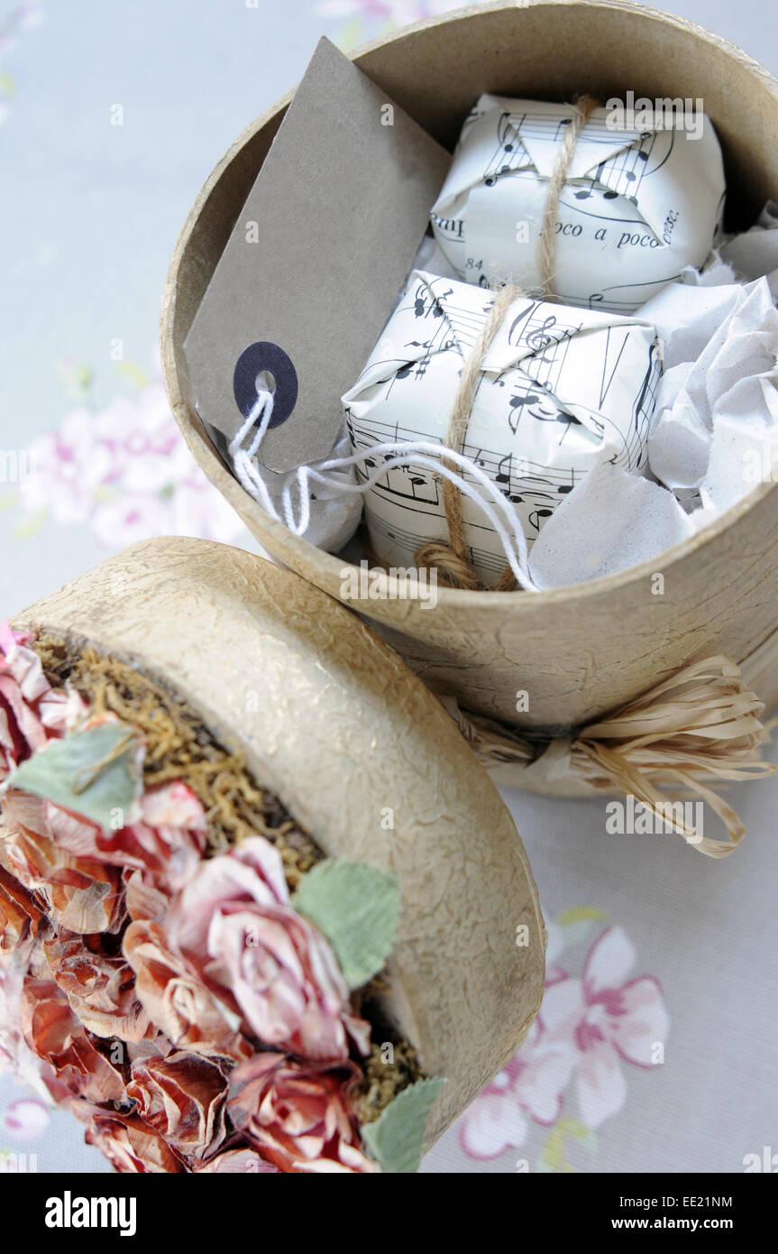 round vintage style gift box filled with pretty wrapped presents Stock Photo