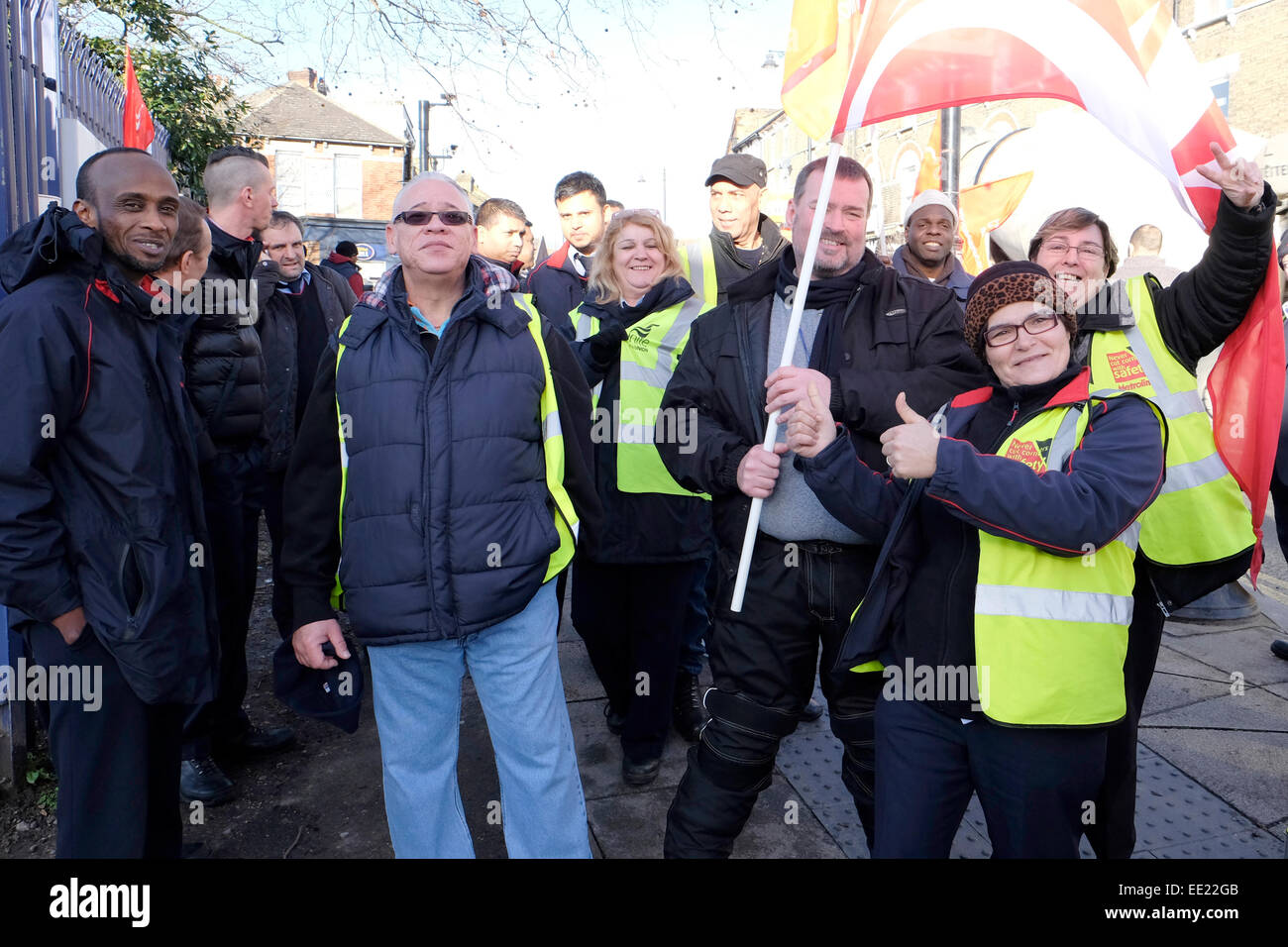Bus drivers stand outside Willesden junction garage during a strike. Stock Photo