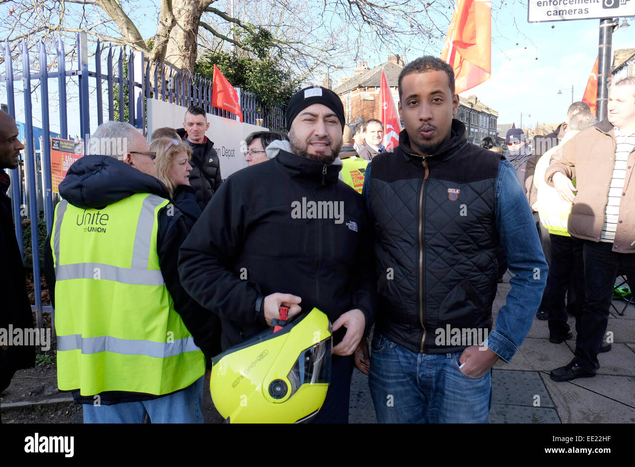 Bus drivers stand outside Willesden junction depot during a strike. Stock Photo