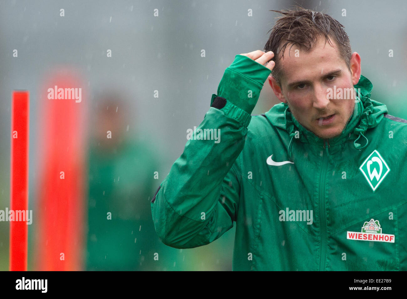 Belek, Turkey. 13th Jan, 2015. Werder Bremen's player Izet Hajrovic wipes the rain from his face during a training session in Belek, Turkey, 13 January 2015. Werder Bremen stays in Belek to prepare for the second half of the German Bundesliga season. Photo: Soeren Stache/dpa/Alamy Live News Stock Photo