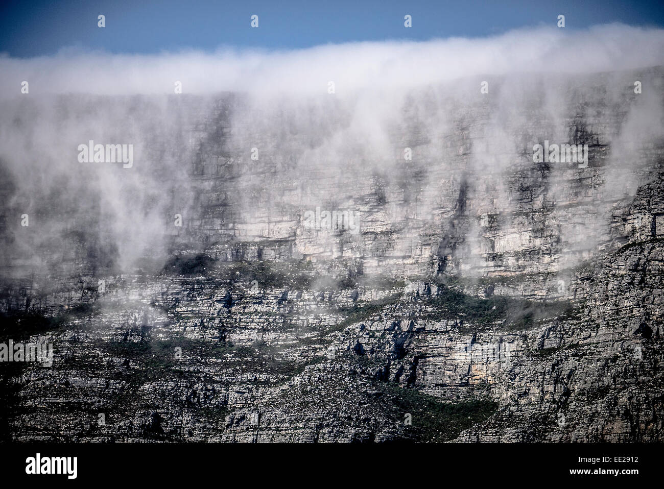 Orographic cloud, 'The Tablecloth', pouring over the face of Table Mountain in Cape Town, South Africa. Stock Photo