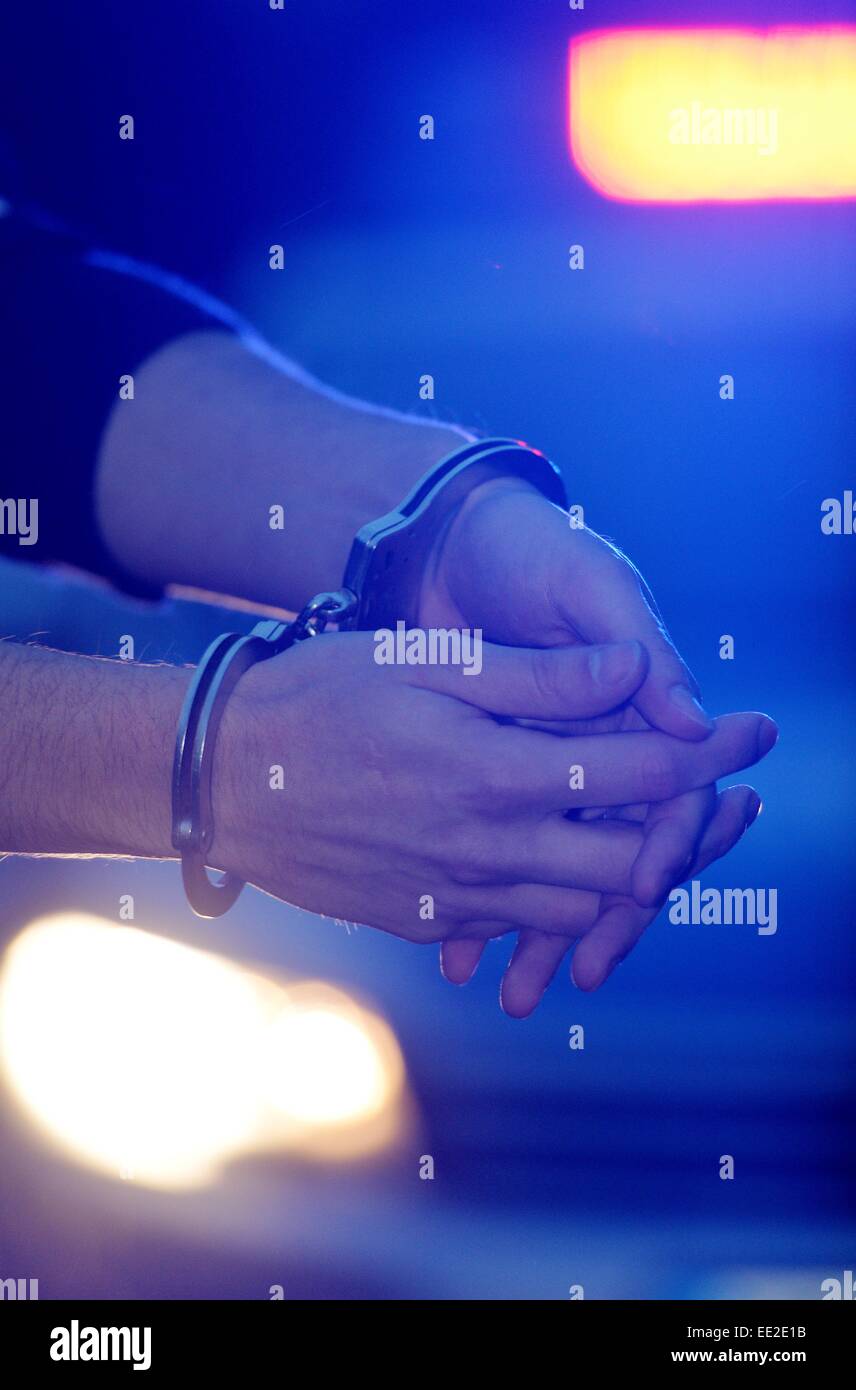 A man with handcuffs, Germany, city of Braunlage, 12. January 2015. Photo: Frank May Stock Photo