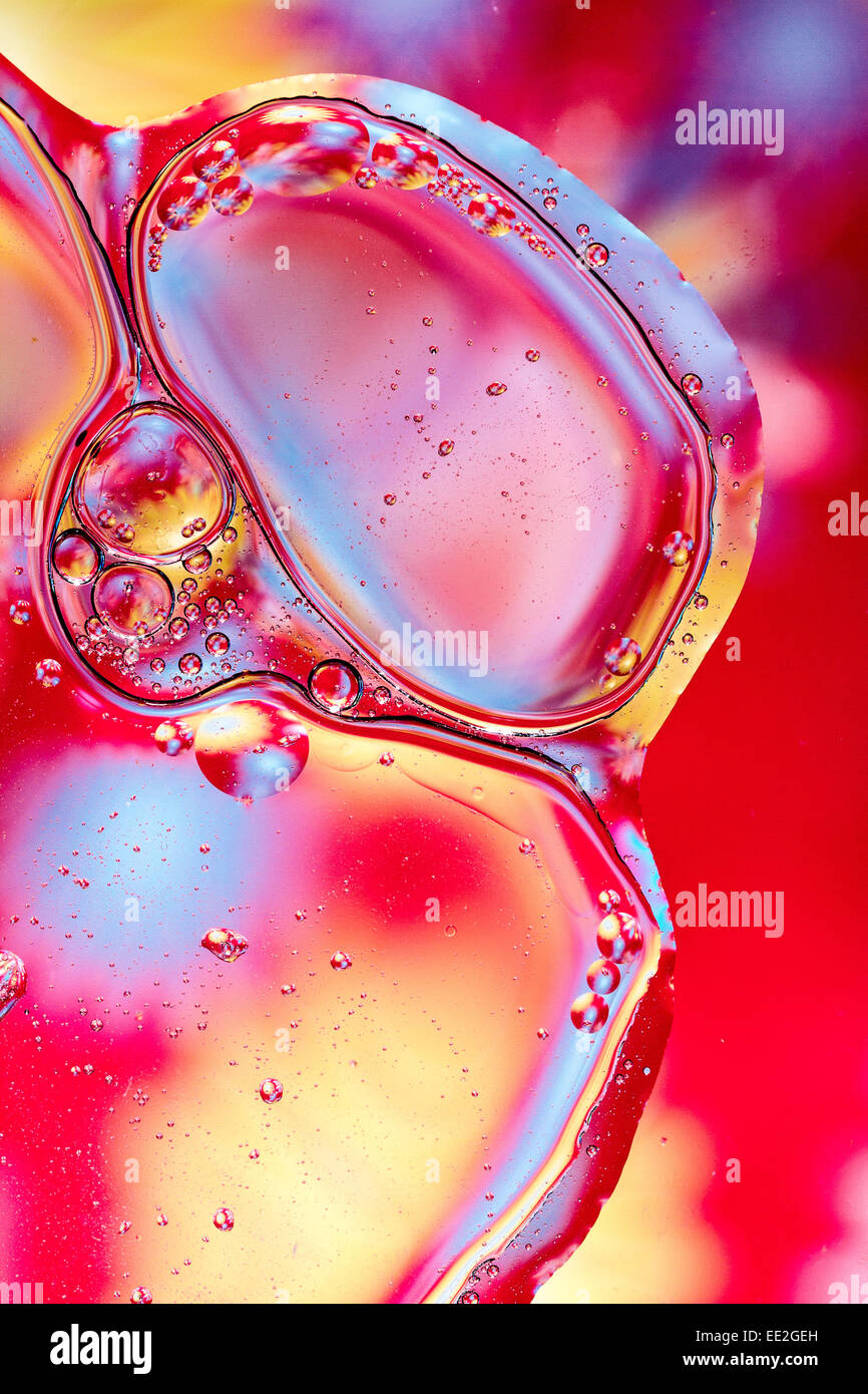 Abstract oil and water pattern.  Red and pink background shapes. Stock Photo