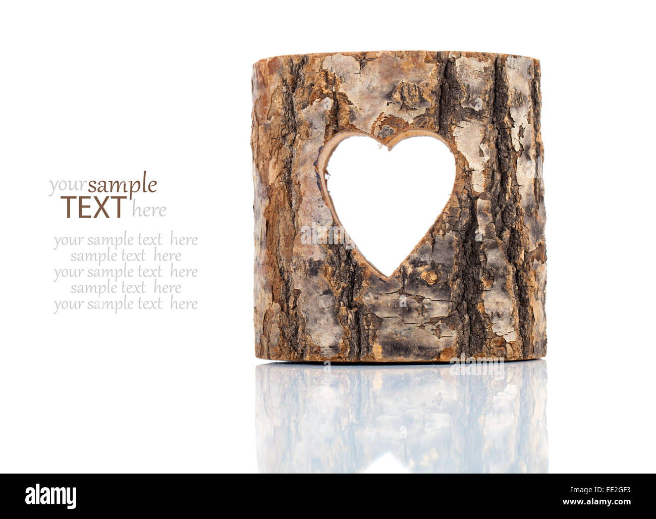 heart cut in hollow tree trunk. on white background Stock Photo