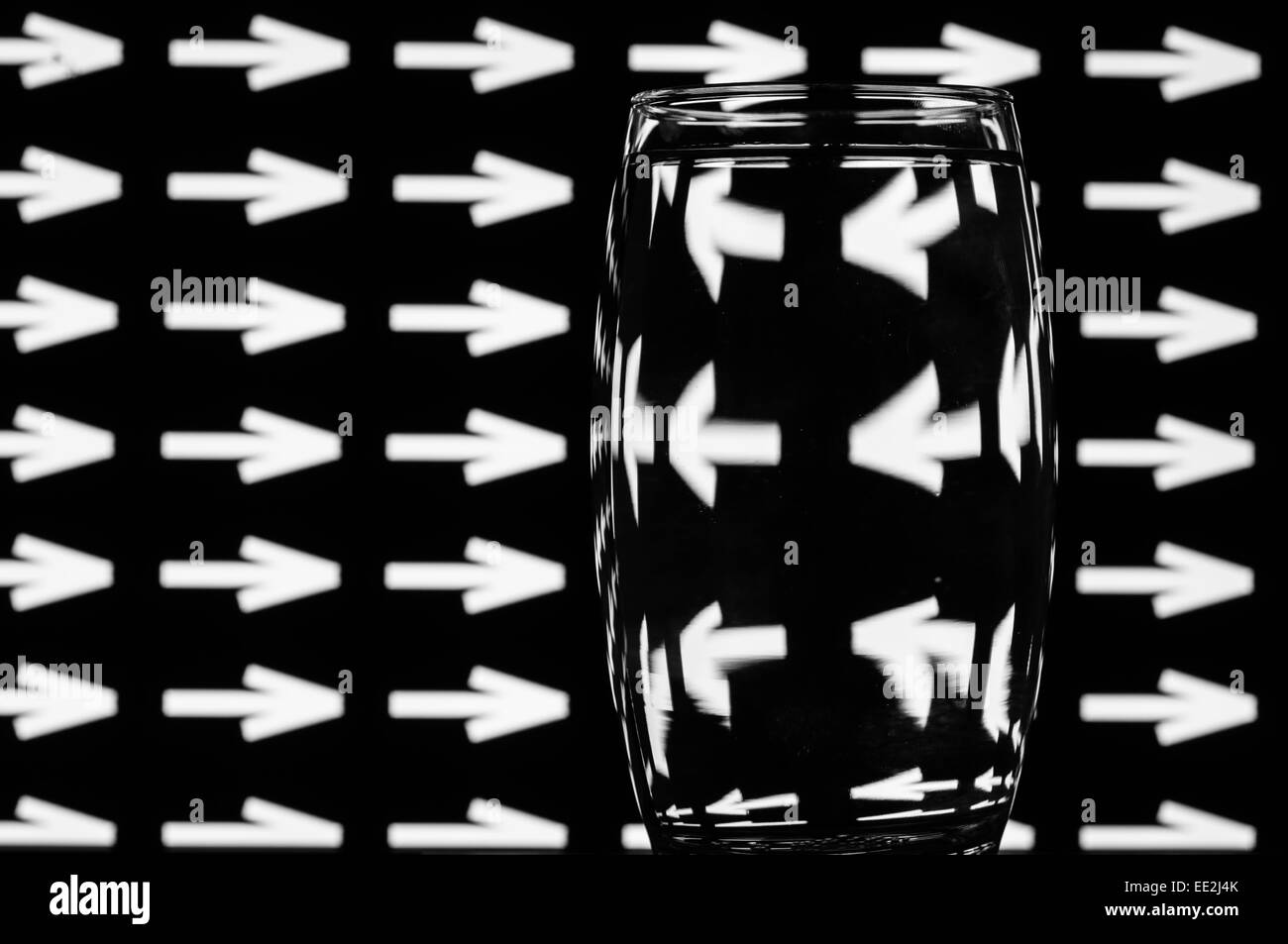 A tumbler of water against a patterned background to illustrate the