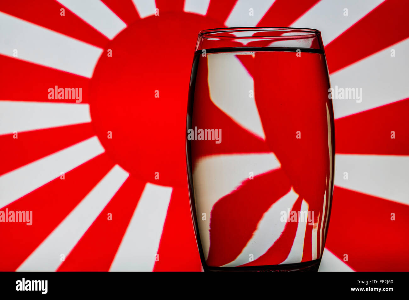A tumbler of water against a patterned background to illustrate the