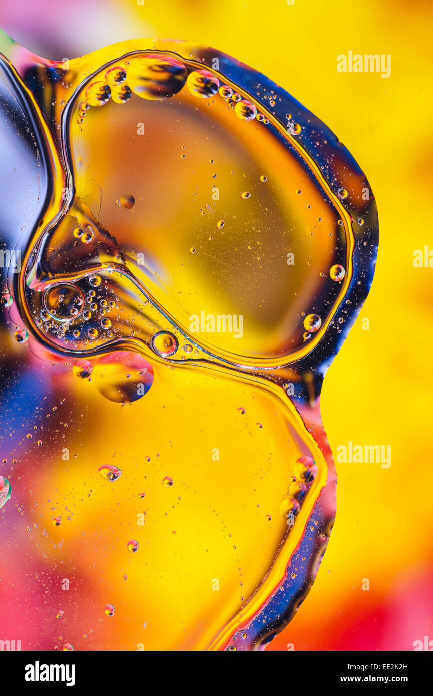 Abstract oil and water pattern.  Golden yellow background shapes. Stock Photo