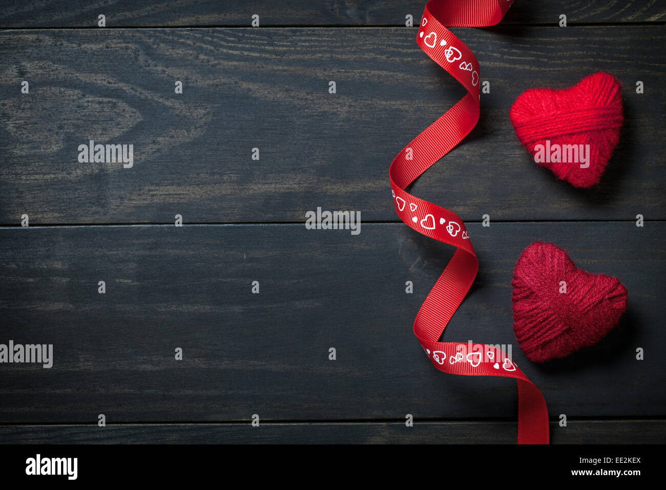 Red hearts made of wool on wooden background for Valentine's Day. Copy ...