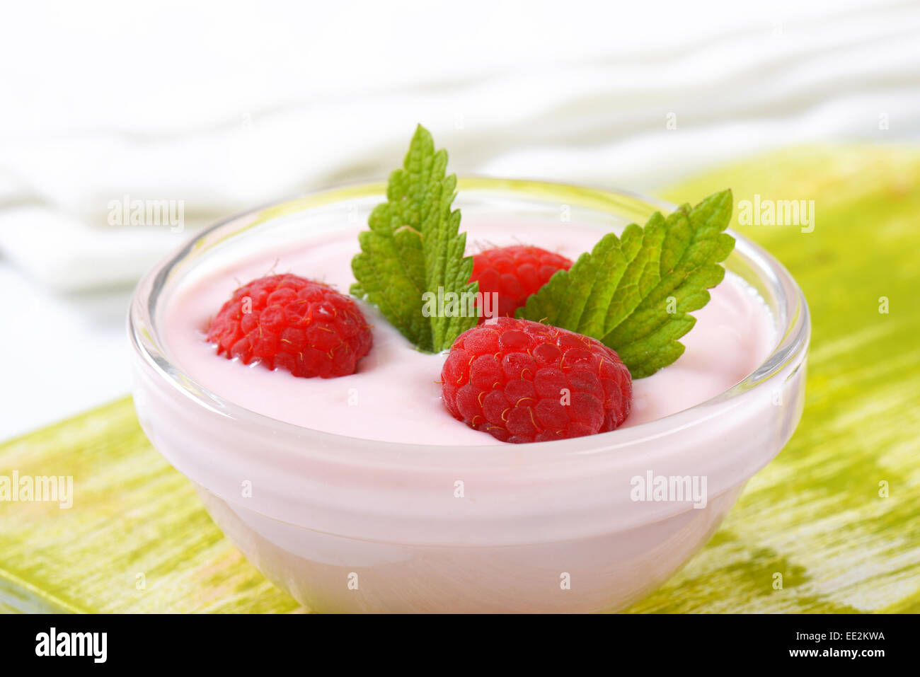 Light raspberry yogurt with fresh raspberries Stock Photo