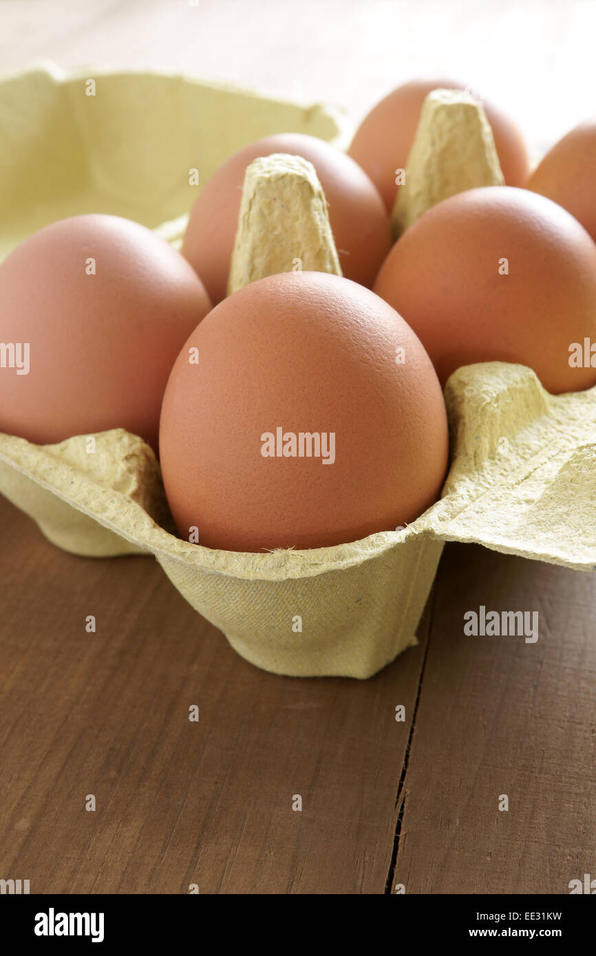 Fresh farm eggs in an egg box Stock Photo