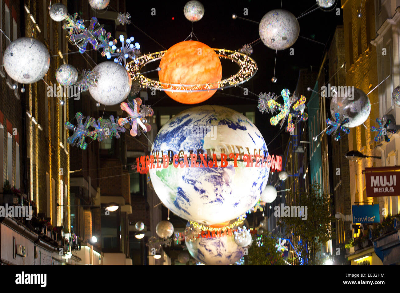 Carnaby Street is only one of many central London streets decorated with imaginative displays of overhead lights at Christmas. Stock Photo