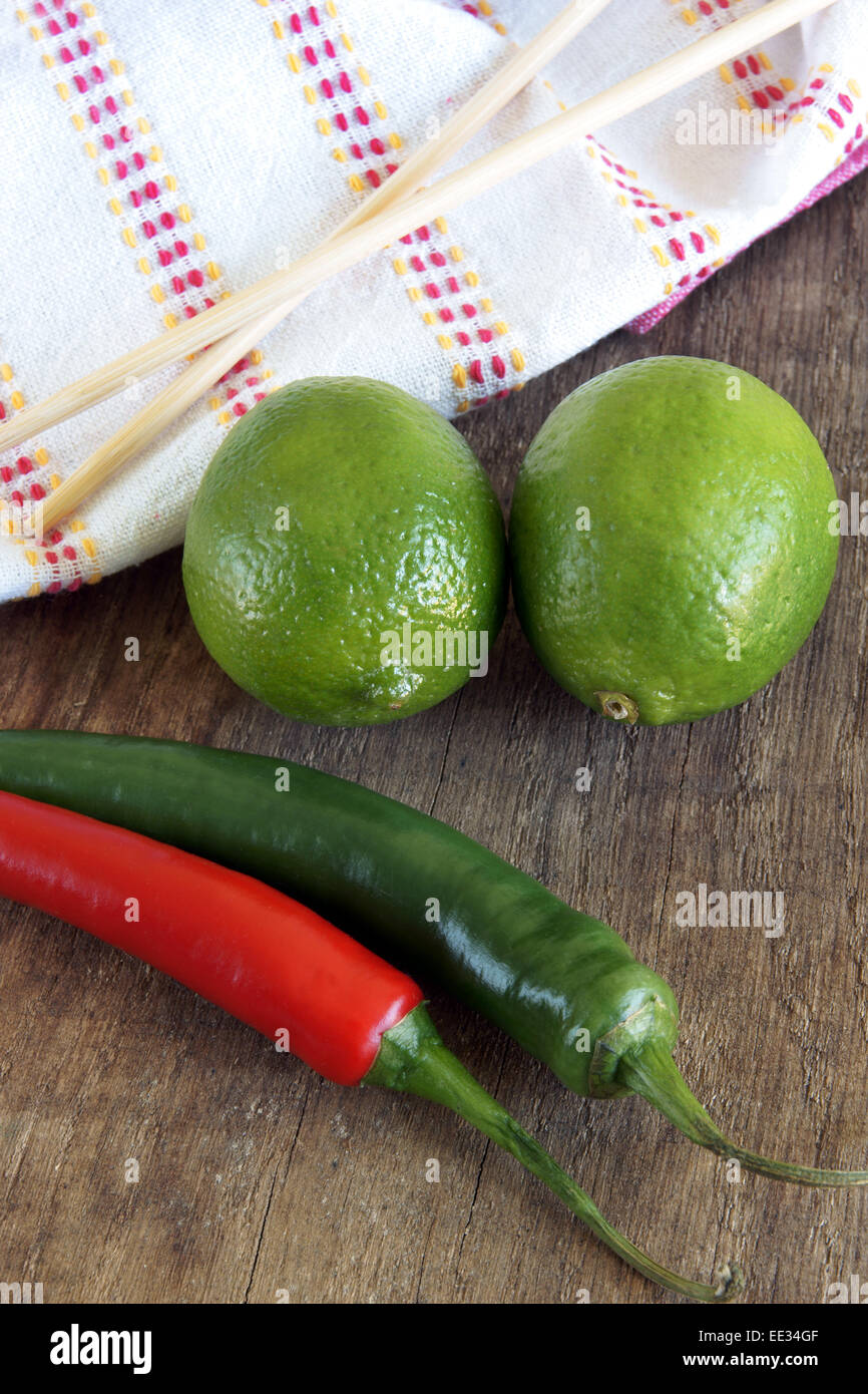 Limes and Chili's Asian food ingredients Stock Photo