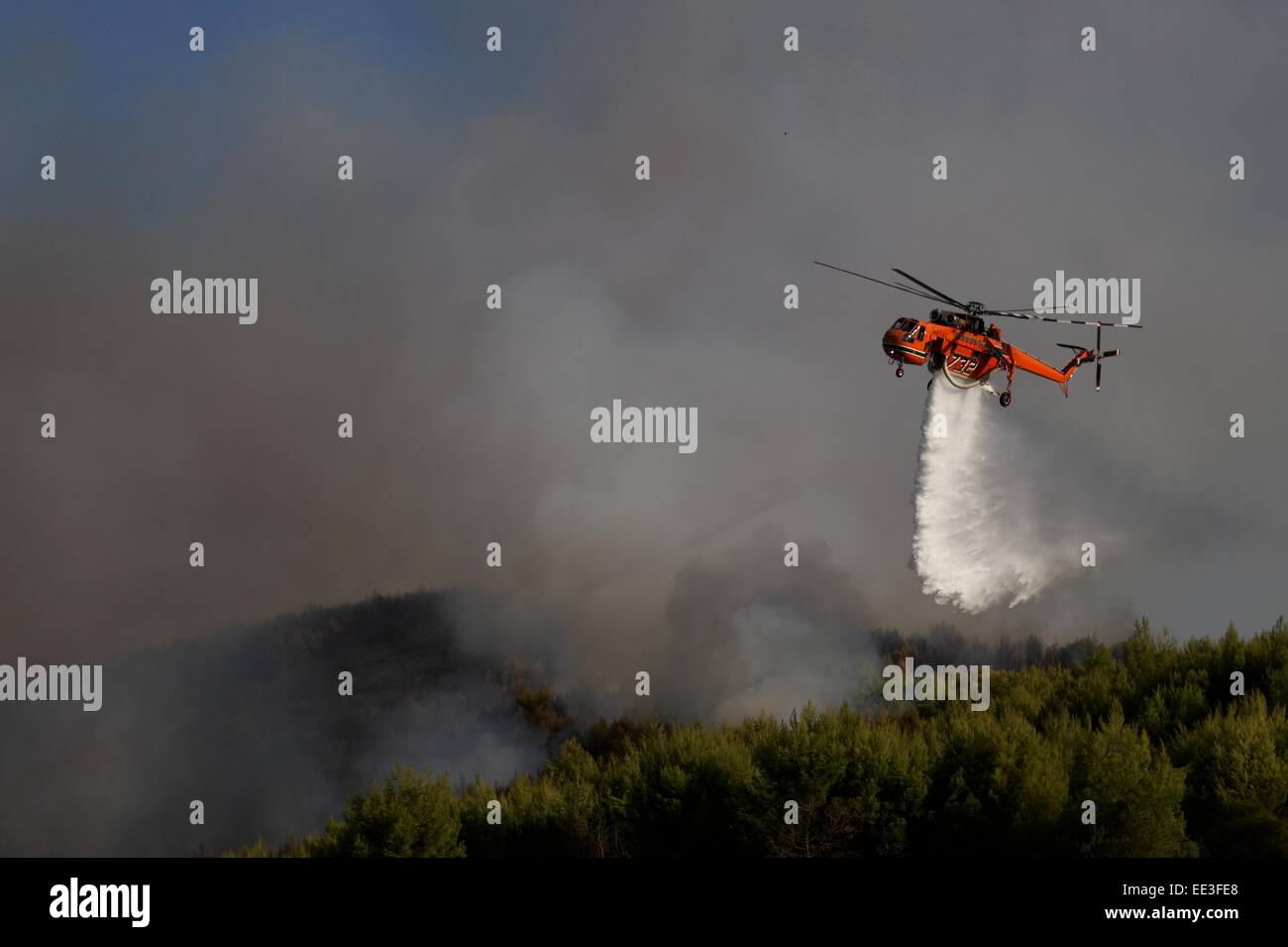 firefighters in action with helicopter Stock Photo - Alamy