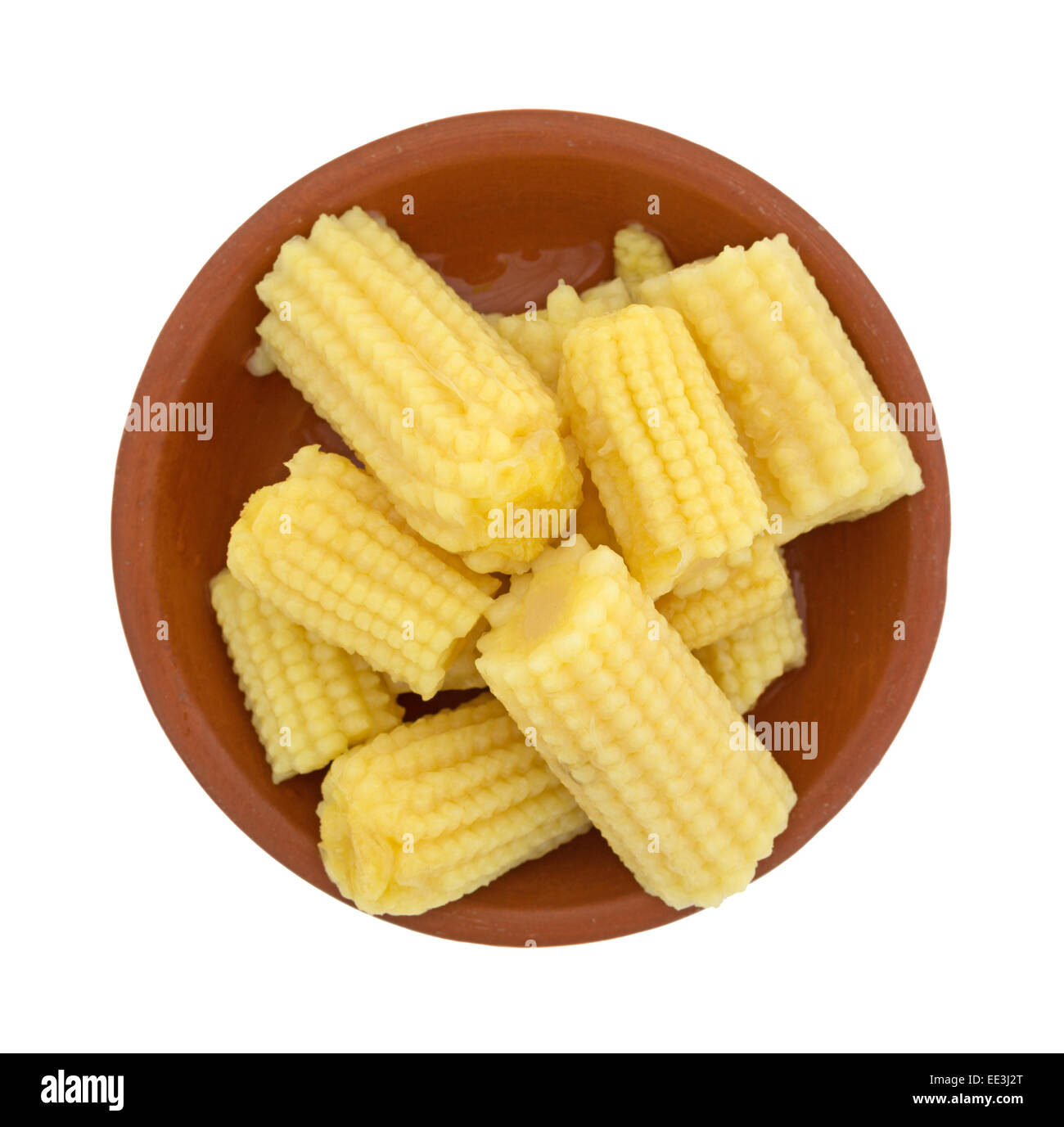 Top view of a small bowl of corn nuggets on a white background. Stock Photo