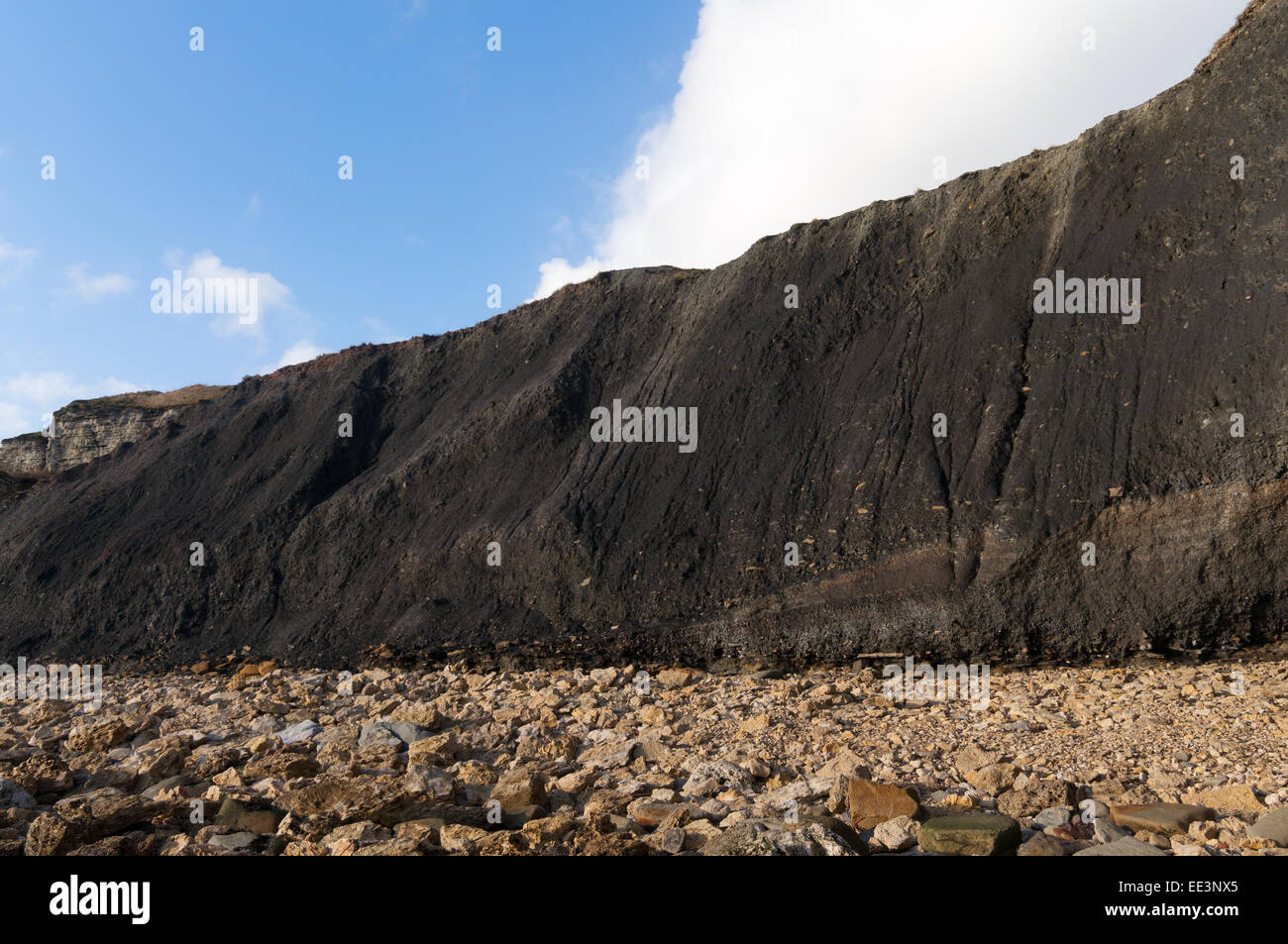 Wall or cliff of coal mine waste deposit or spoil, Blast Beach, Seaham, north east England, UK Stock Photo