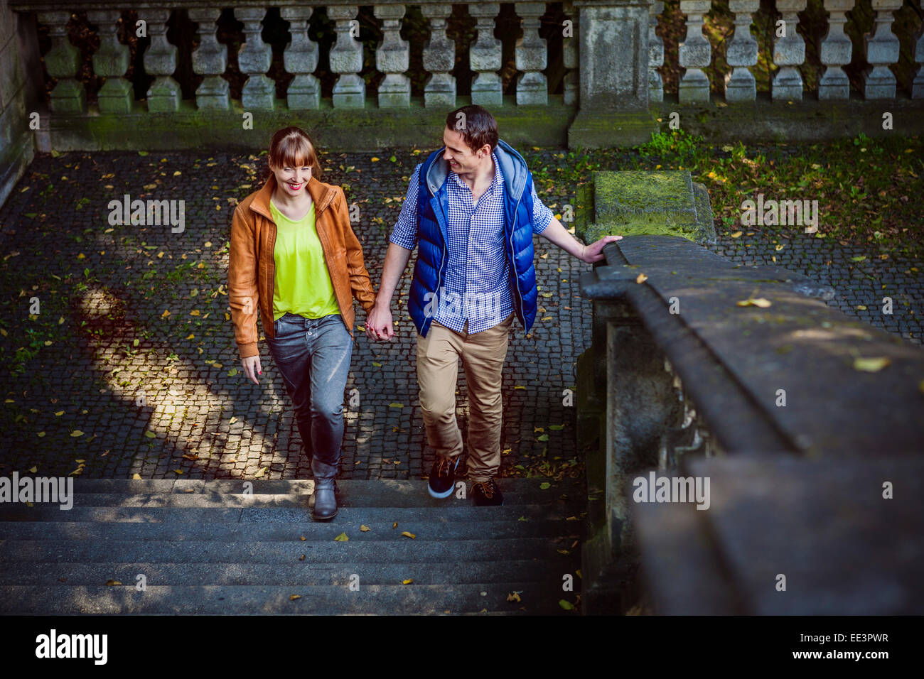 Young couple holding hands, Munich, Bavaria, Germany Stock Photo