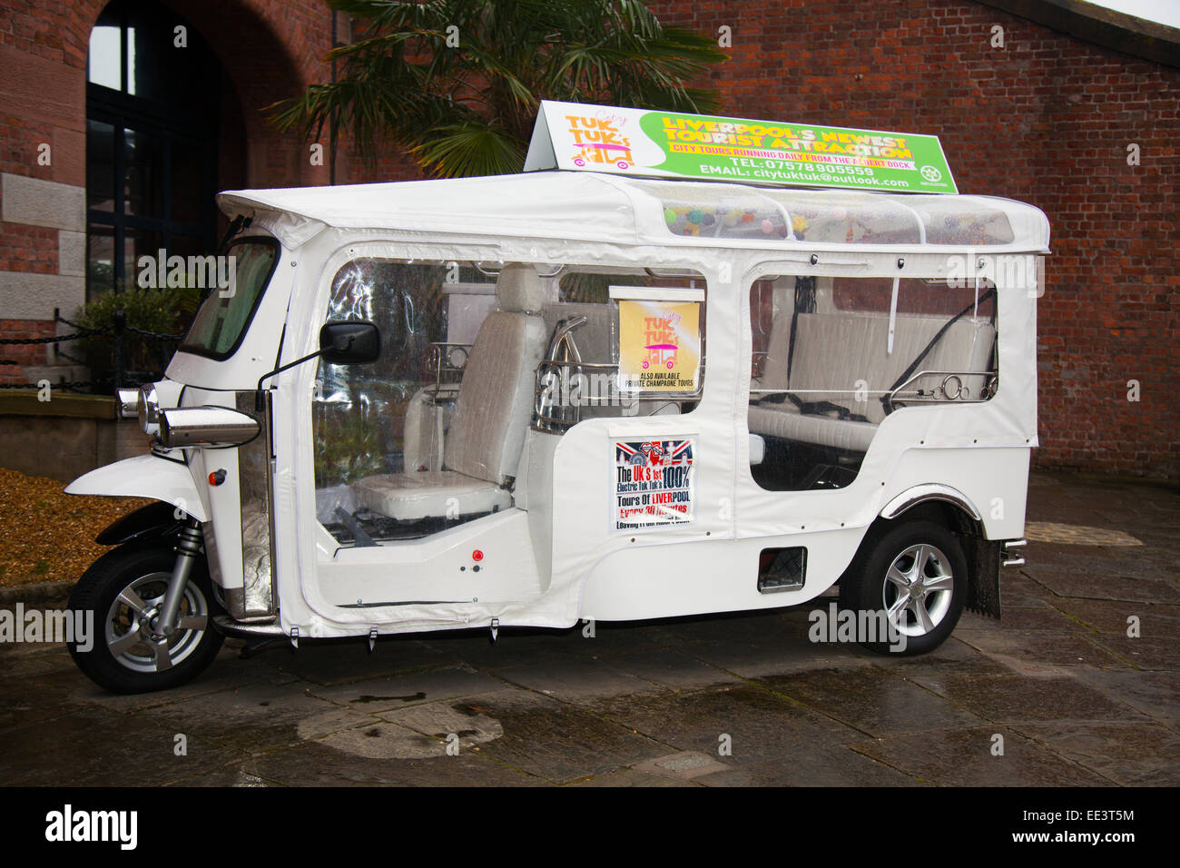 New electricpowered white TukTuk vehicles an innovative Tourist Stock