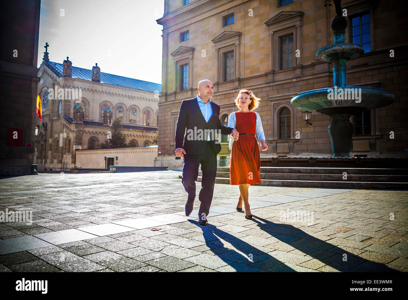 Senior couple walking in town, Munich, Bavaria, Germany Stock Photo
