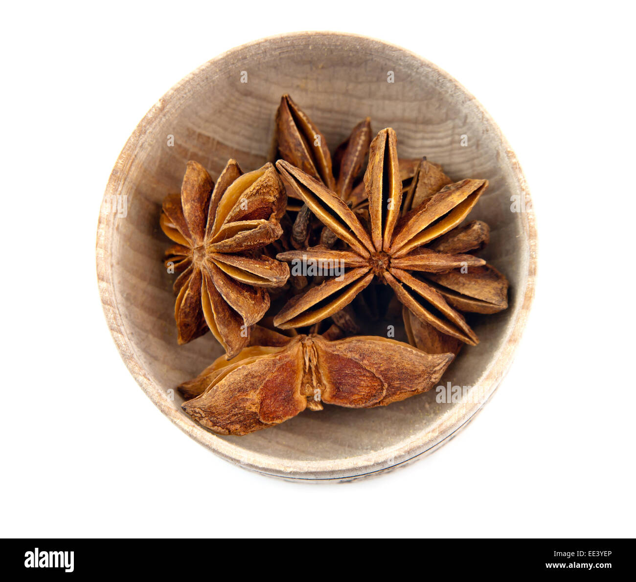 star anise placed on wood dishes white background Stock Photo Alamy