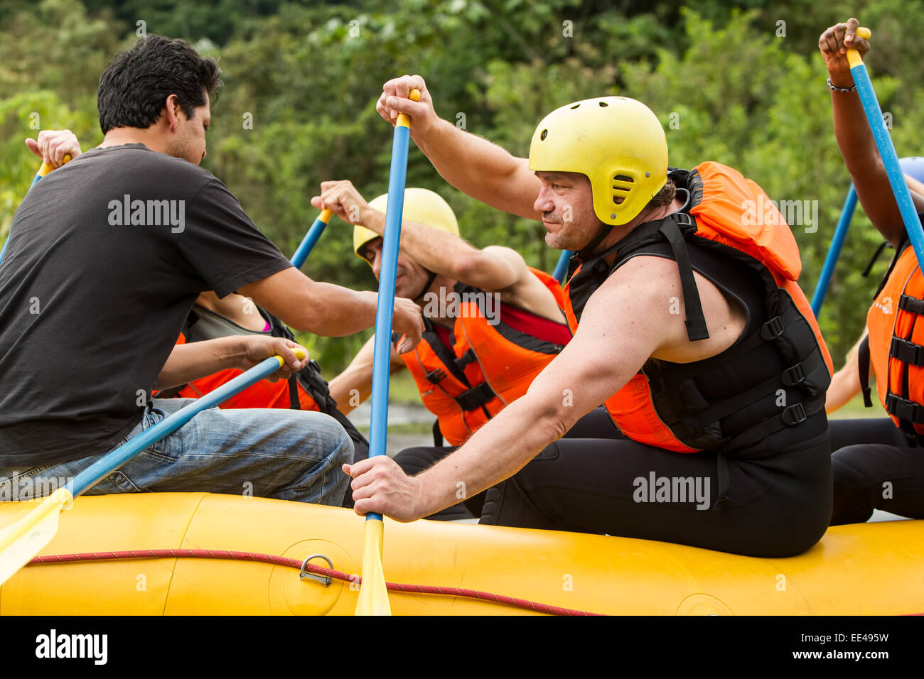White Water Rafting Instructor Teaching Correct Technique For Paddling