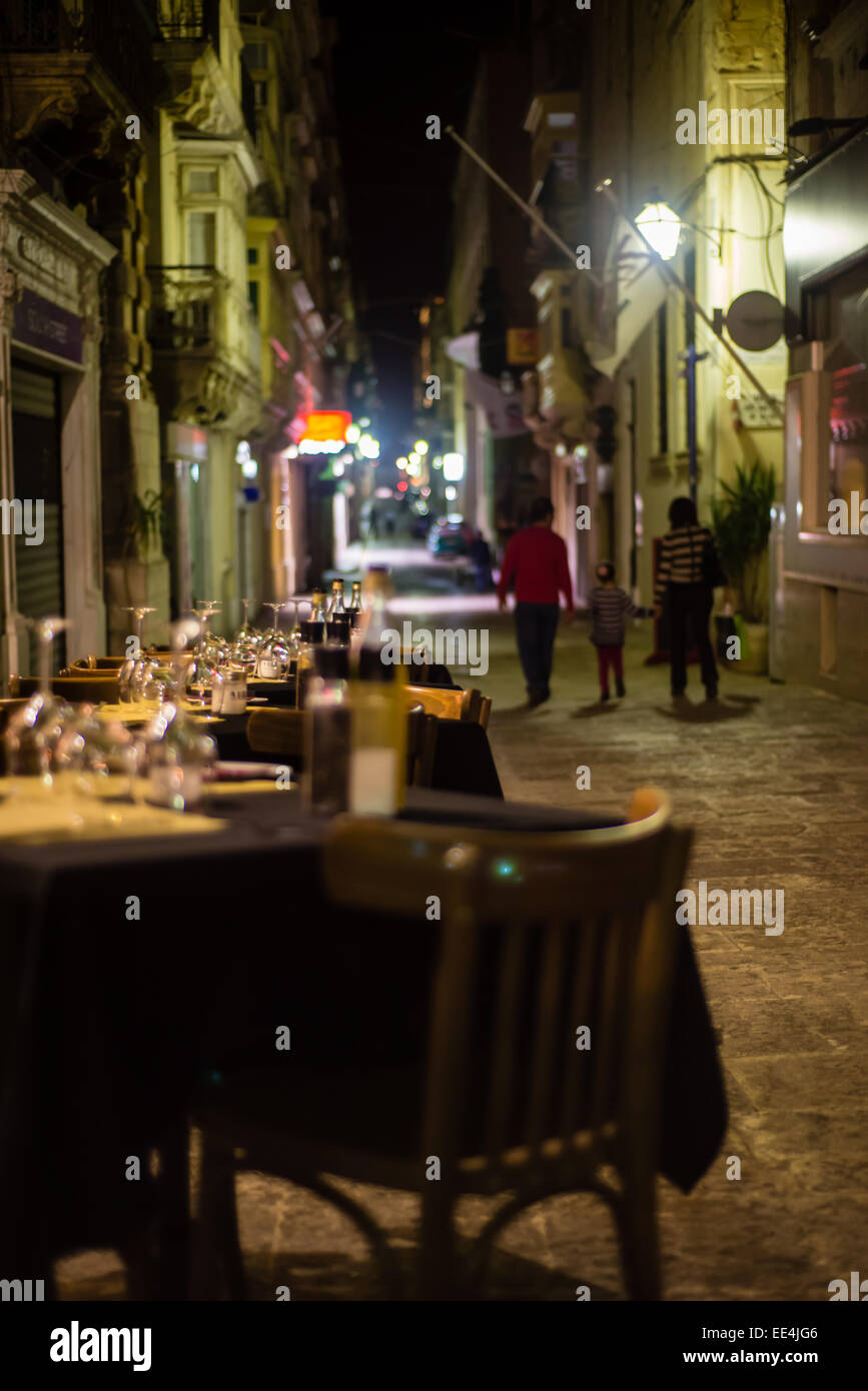 Restaurant tables in an alley in Valletta, Malta Stock Photo Alamy