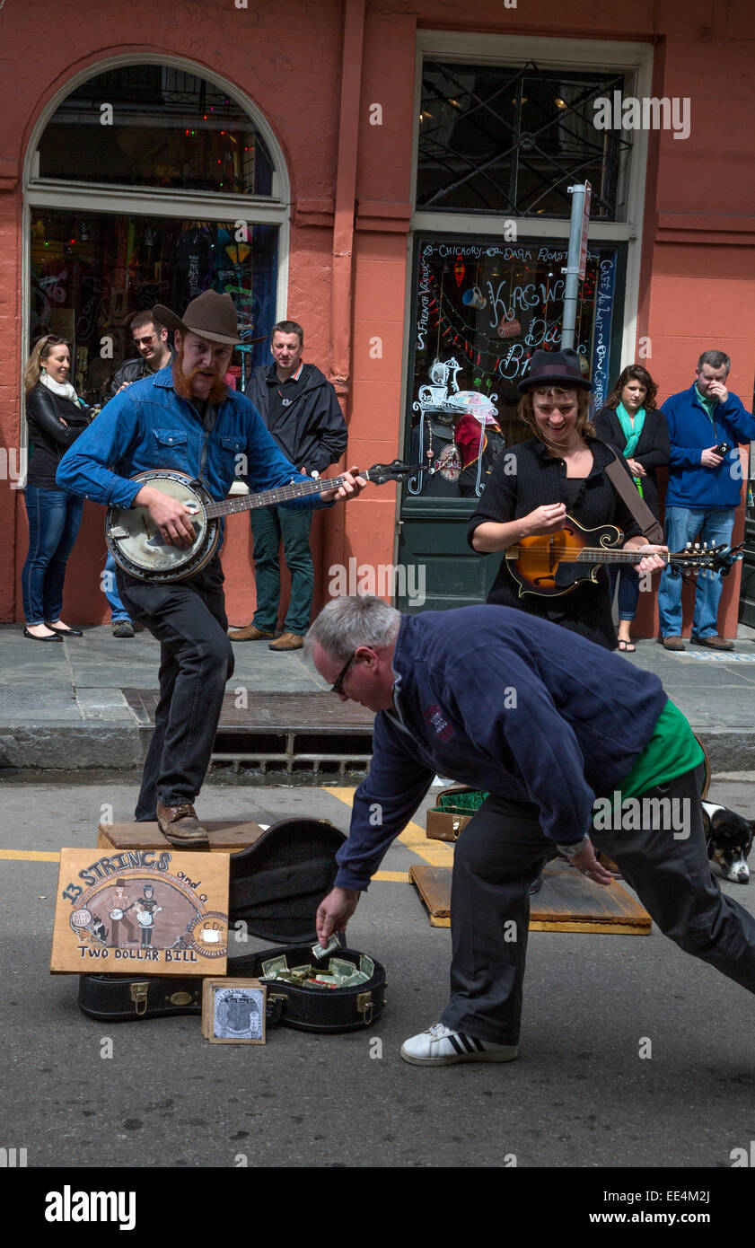 French Quarter, New Orleans, Louisiana.  Street Performers.  Tap Dancer and Banjo Player.  '13 Strings and a Two Dollar Bill'. Stock Photo