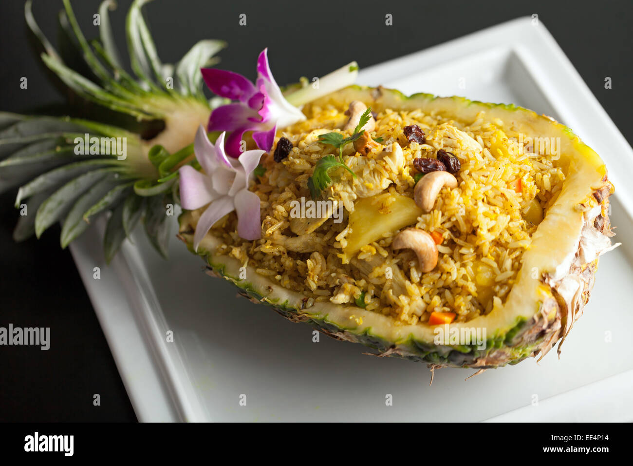 Freshly prepared pineapple fried rice served inside of a pineapple