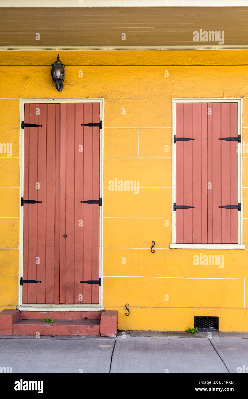 French Quarter, New Orleans, Louisiana.  Shuttered Door and Window of a Creole-style House. Stock Photo