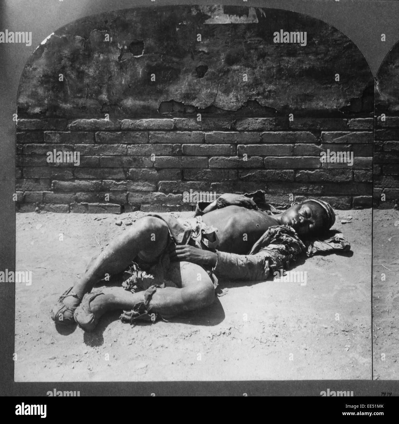 A Beggar awaiting Death, Beijing, China, 1901 Stock Photo
