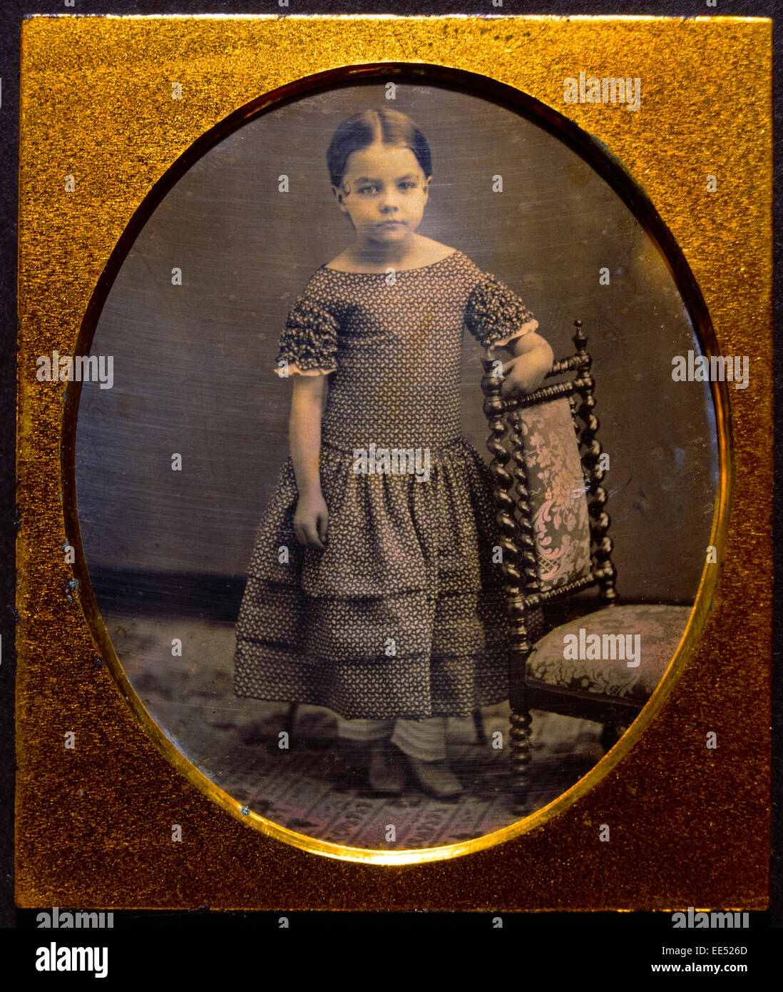 Young Girl Standing Next to Chair, Portrait, Daguerreotype, circa 1850's Stock Photo