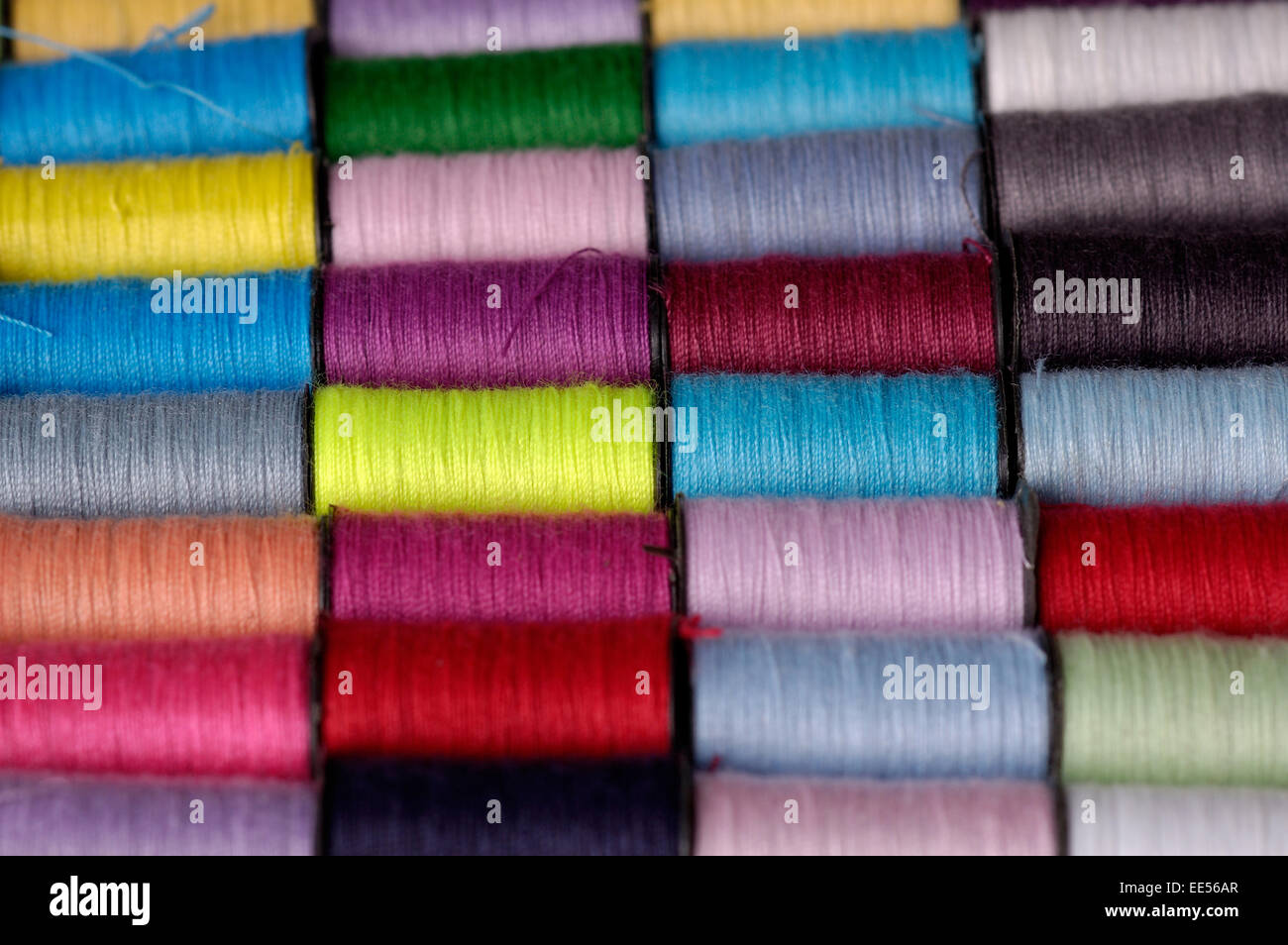Stock photo of many bright colored small spools of thread Stock Photo ...