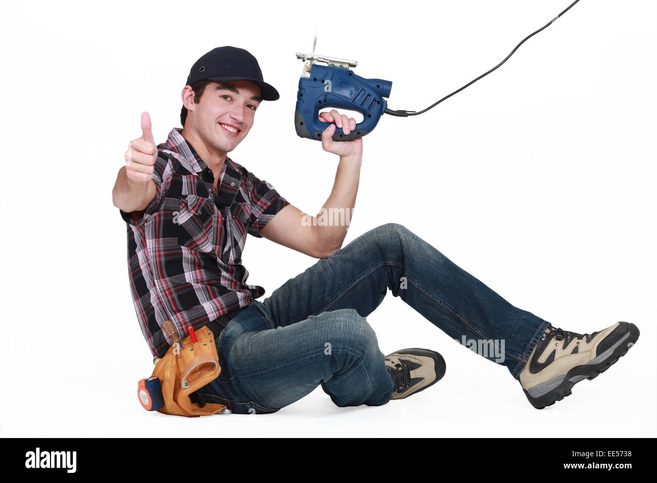 young craftsman making a thumbs up sign Stock Photo