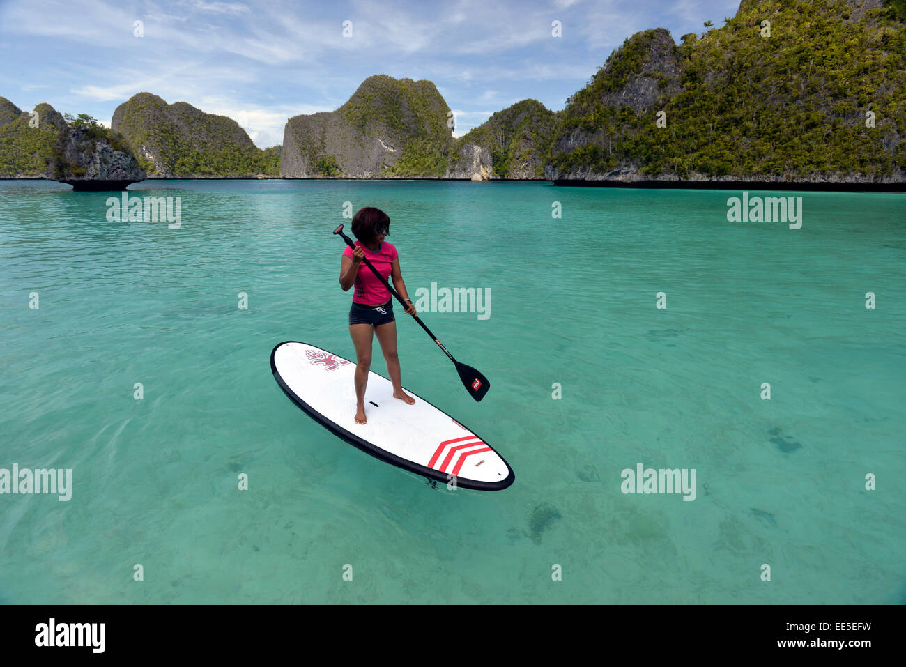 Stand up paddling in Wayag Island Raja Ampat Indonesia Stock Photo Alamy