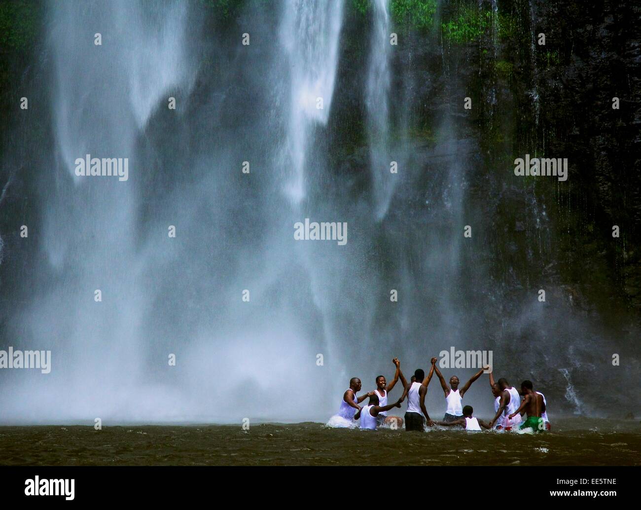 Celebrating by the waterfall. Volta Region Ghana Stock Photo