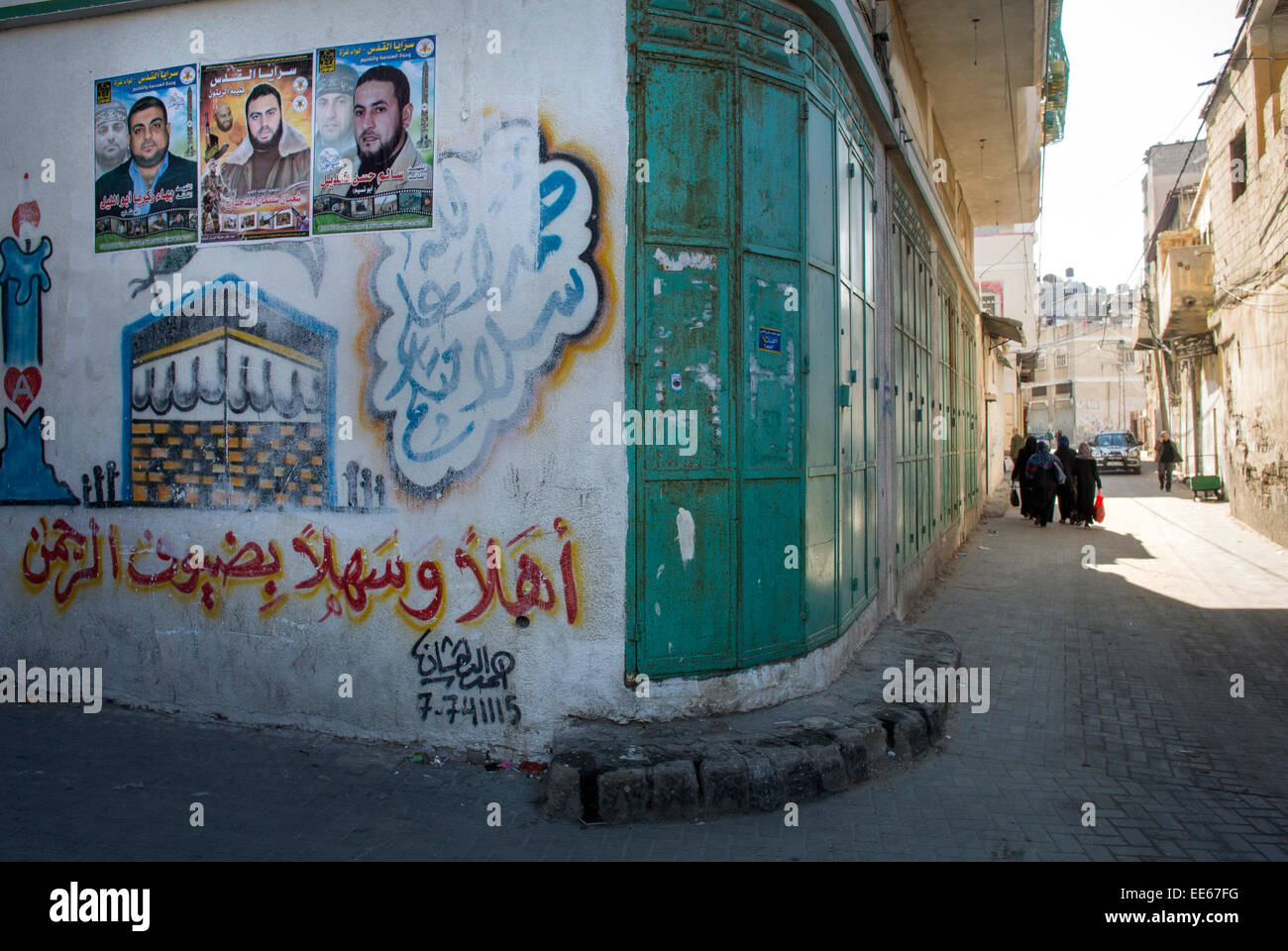 Street scene in Gaza City,Gaza Strip. The poster's on the left wall are ...