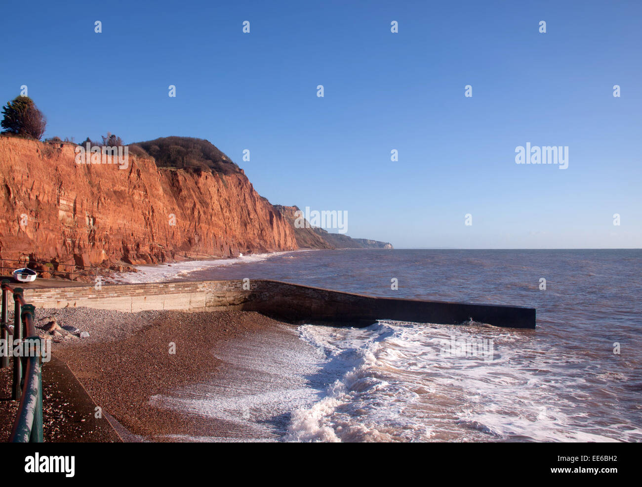 Cliff erosion at Sidmouth, Devon, the sea is endangering property on top of East cliff as it cuts into the cliff face 1 mtre p/a Stock Photo