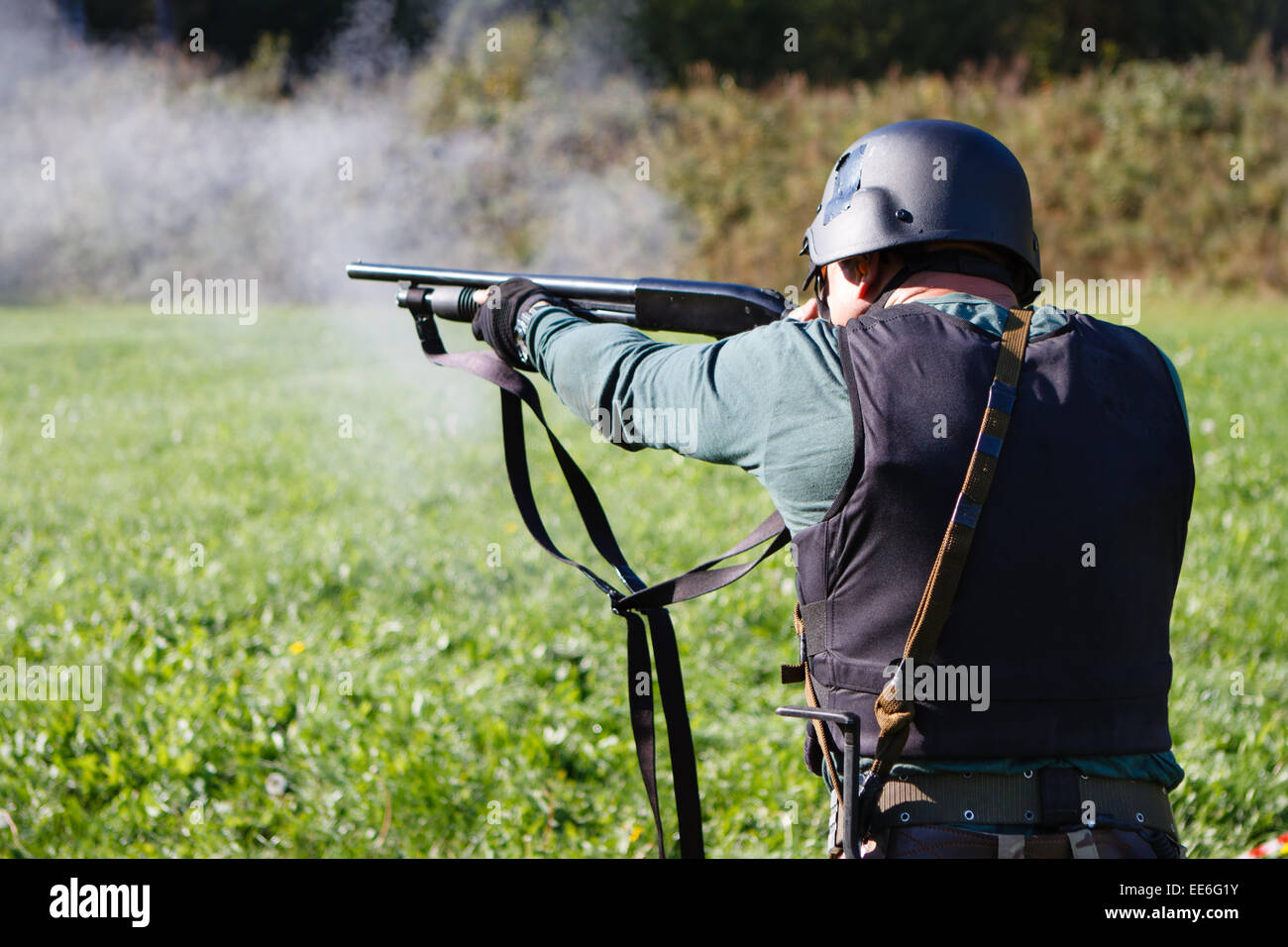 Spec ops soldier shooting shotgun. Stock Photo