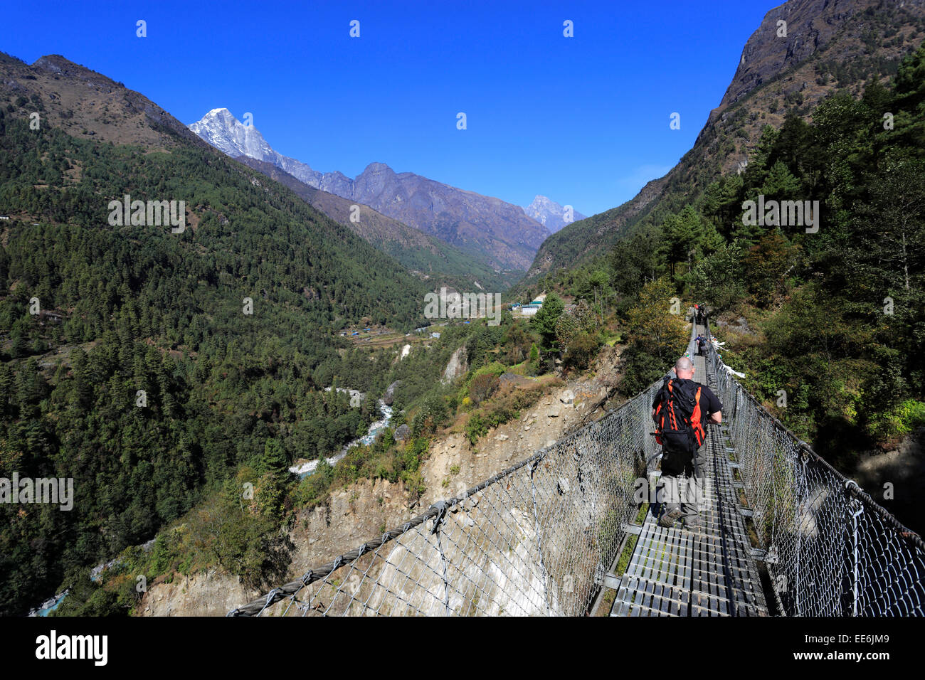 Metal suspension Bridge over the Chineplung Khola river, Chineplung village, Sagarmatha National Park, Solukhumbu district, Khum Stock Photo