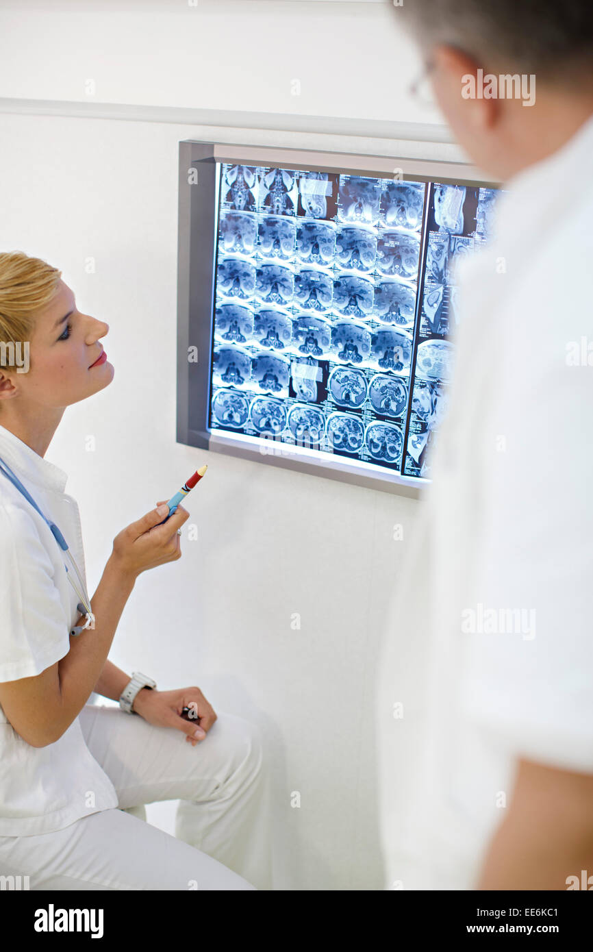 Doctors Examining MRI Scans Stock Photo